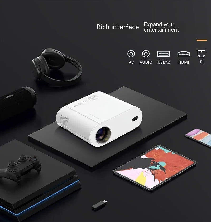 White Full HD smart projector with remote control on a wooden surface.