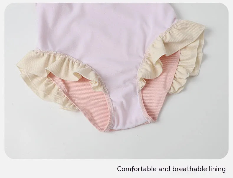 Women's pink conservative one-piece nylon swimsuit shown front view
