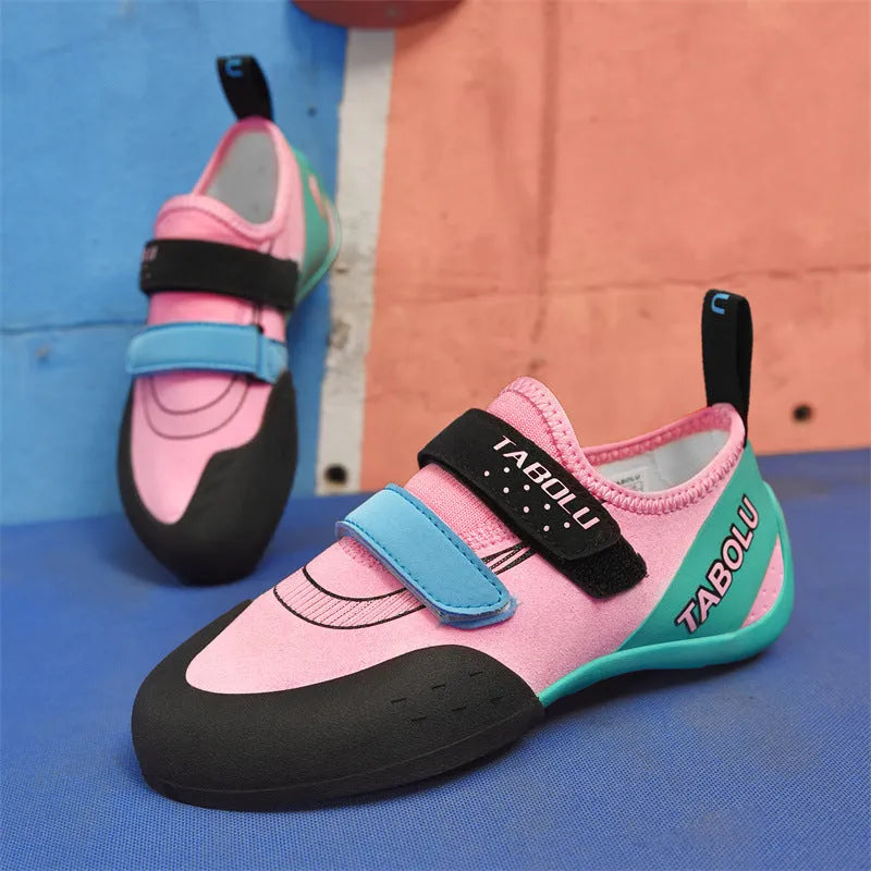 Beginner unisex rock climbing shoes with Velcro strap in black and red colour option.