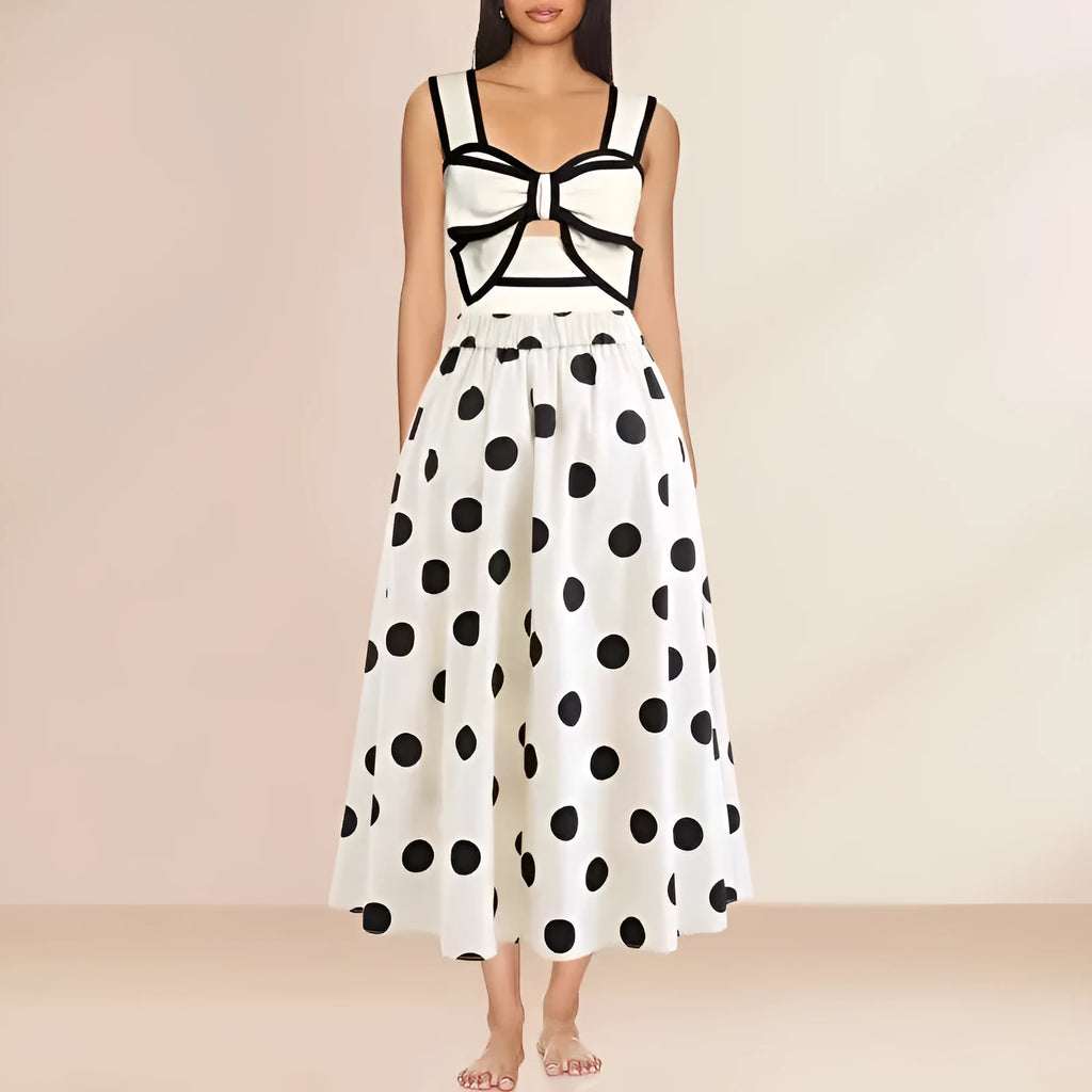 Women's black one-piece swimsuit with a white bow and round skirt, made from polyester.