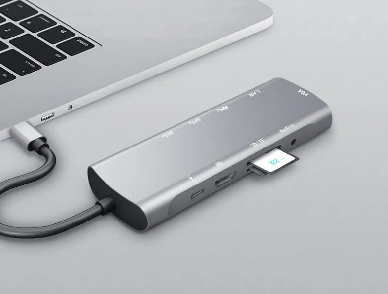 Grey aluminium USB-C docking station with HDMI, VGA, and USB ports