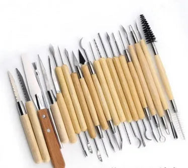 A 27-piece pottery clay tools set with wood, stainless steel, and plastic tools rolled up in packaging.