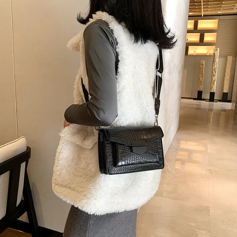 Vintage PU leather crossbody bag in black, shown with adjustable strap.