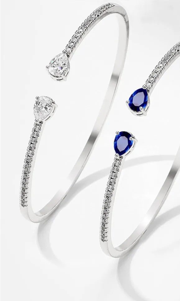 Multi-zircon copper bracelet with inlaid stones in blue or white colour options