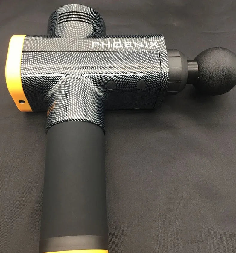 Black fascia gun massage tool with four removable heads on grey background