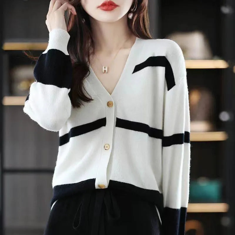 Women's black and white striped V-neck knitted cardigan with a 3D pattern and slim fit.