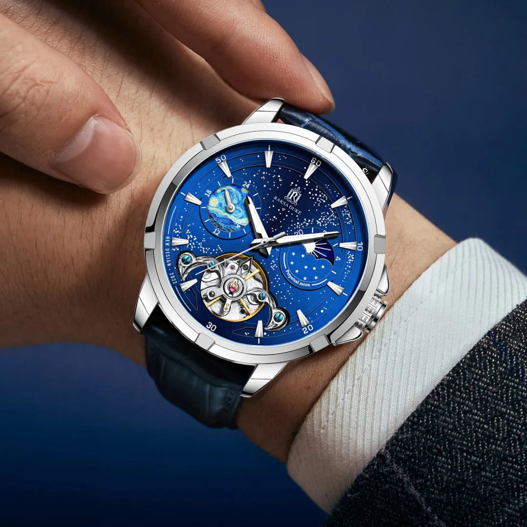Men's blue automatic mechanical watch with stainless steel bracelet on wrist, showing T885B dial.