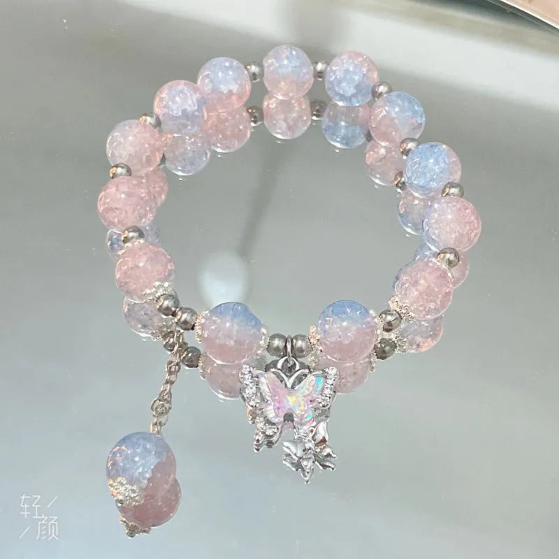 Chinese style handmade glass bead bracelet with bamboo joint elements on a white background.