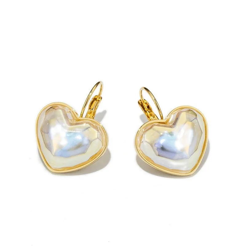 Gold coloured women's clip-on earring made from alloy with metal design details.