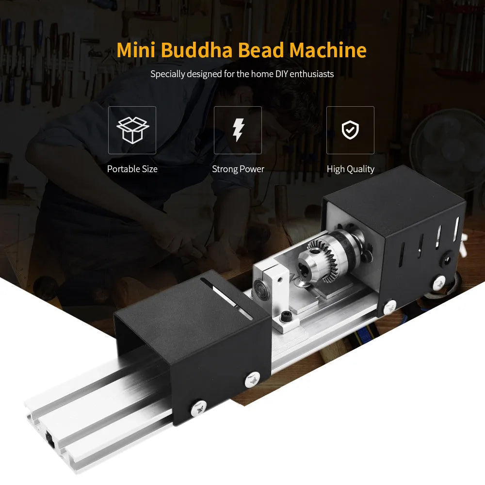 Silver metal manual mini woodworking lathe with carving tools on a workbench.