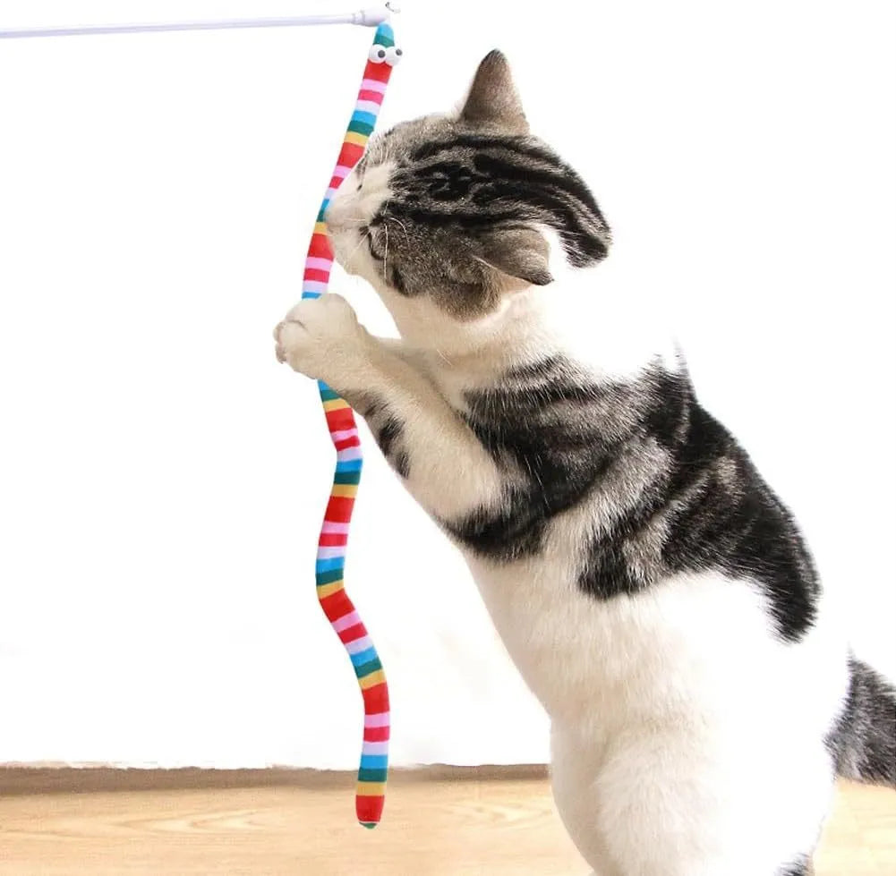 Green cat wand toy with long plush strip on a polycarbonate pole, shown mid-swing.