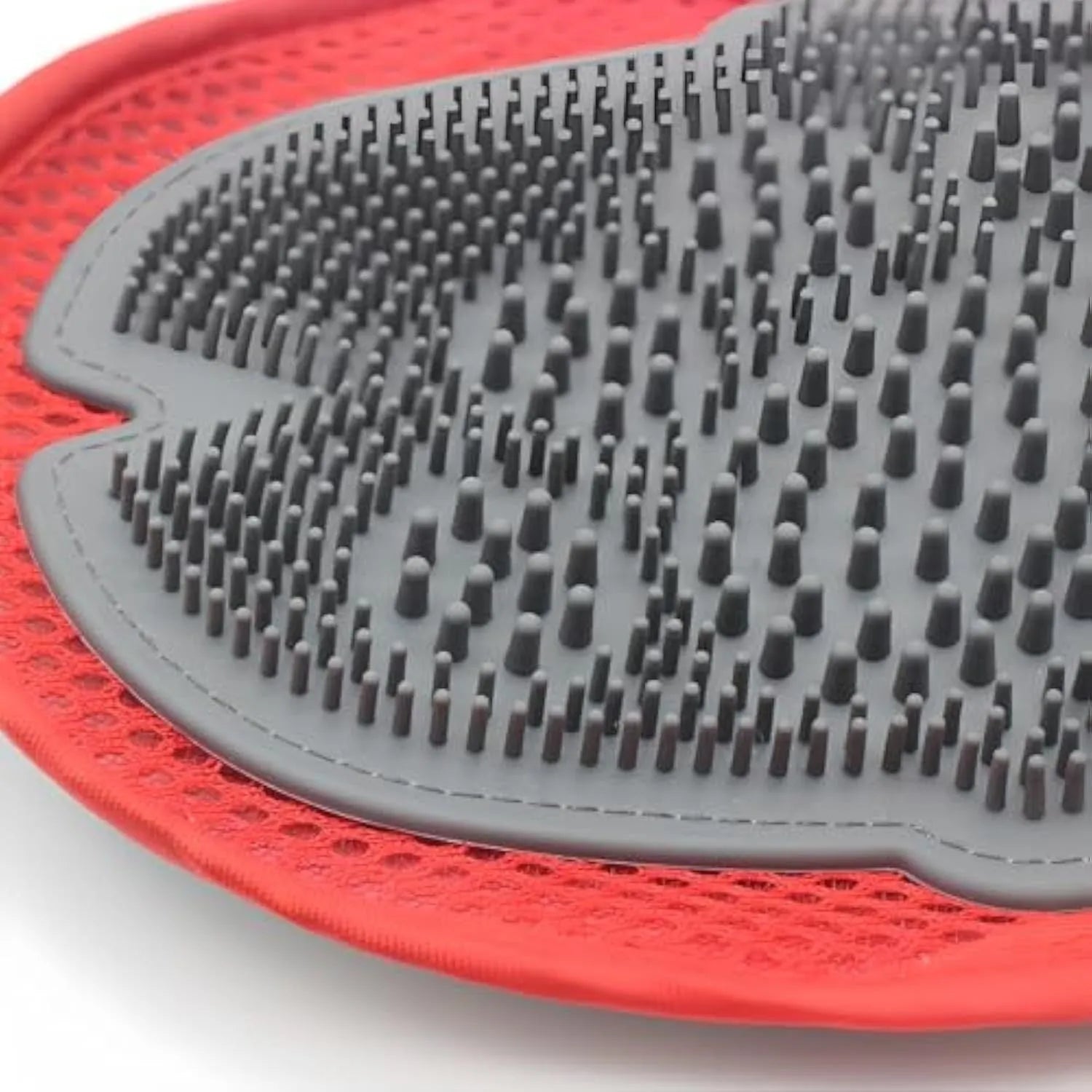 Red pet bathing glove with integrated brush for dog and cat grooming during washing