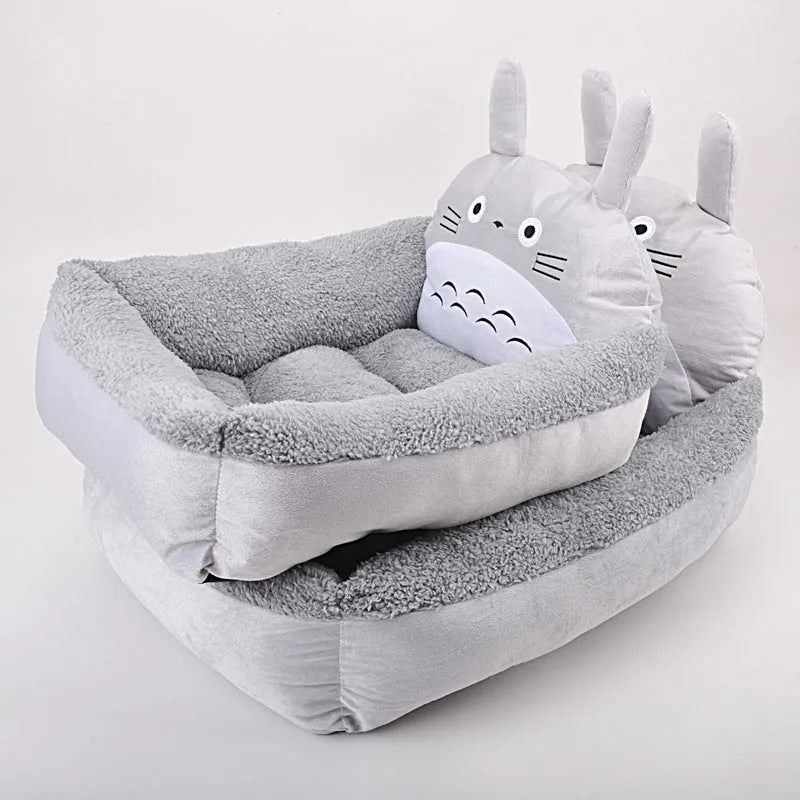 Cartoon-style sofa pet bed for small dogs and cats, shown in various colours.