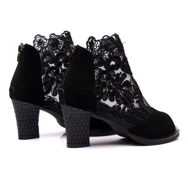 Black women's gladiator sandals with floral lace upper, square high heel, peep toe, and zip closure.