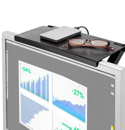 Black adjustable 13-inch screen top shelf mounted above a monitor, holding a streaming device and remote.
