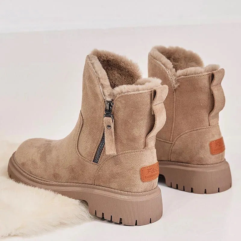 Women's black faux suede snow boots with thick plush lining and side zip closure