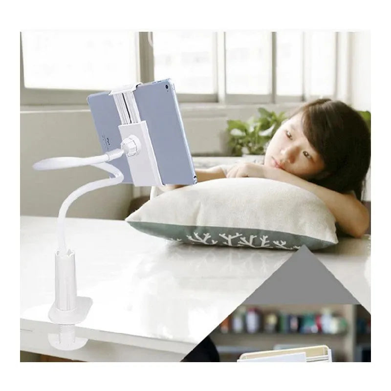 Black flexible phone tablet mount holder with suction base and bendy magnalium arm on a desk.