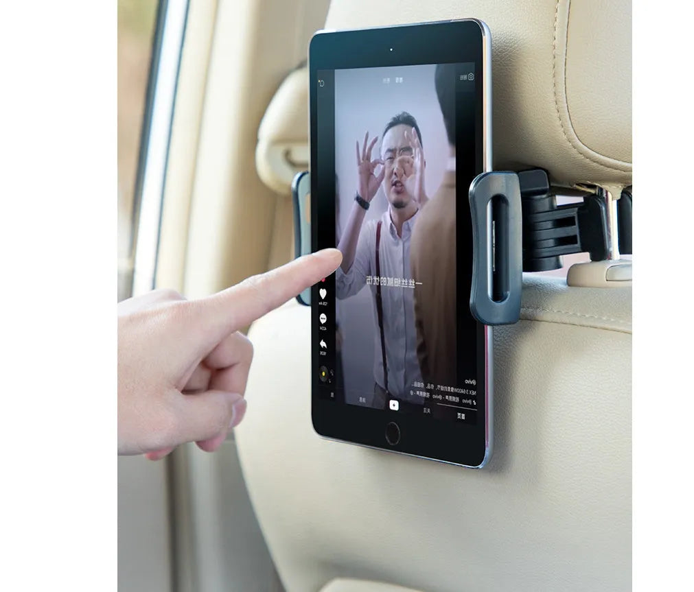 Black plastic universal car phone holder mounted on a car rear seat base.