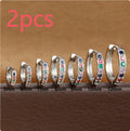 Perforated circle zircon stud earrings in gold colour with geometric pattern and butterfly clasp