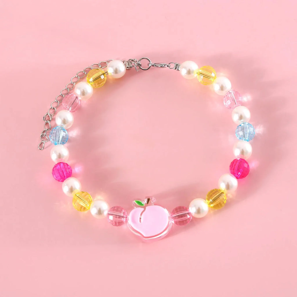 Colourful plastic bead cat necklace with adjustable sizing in peach, rainbow, and small flower patterns