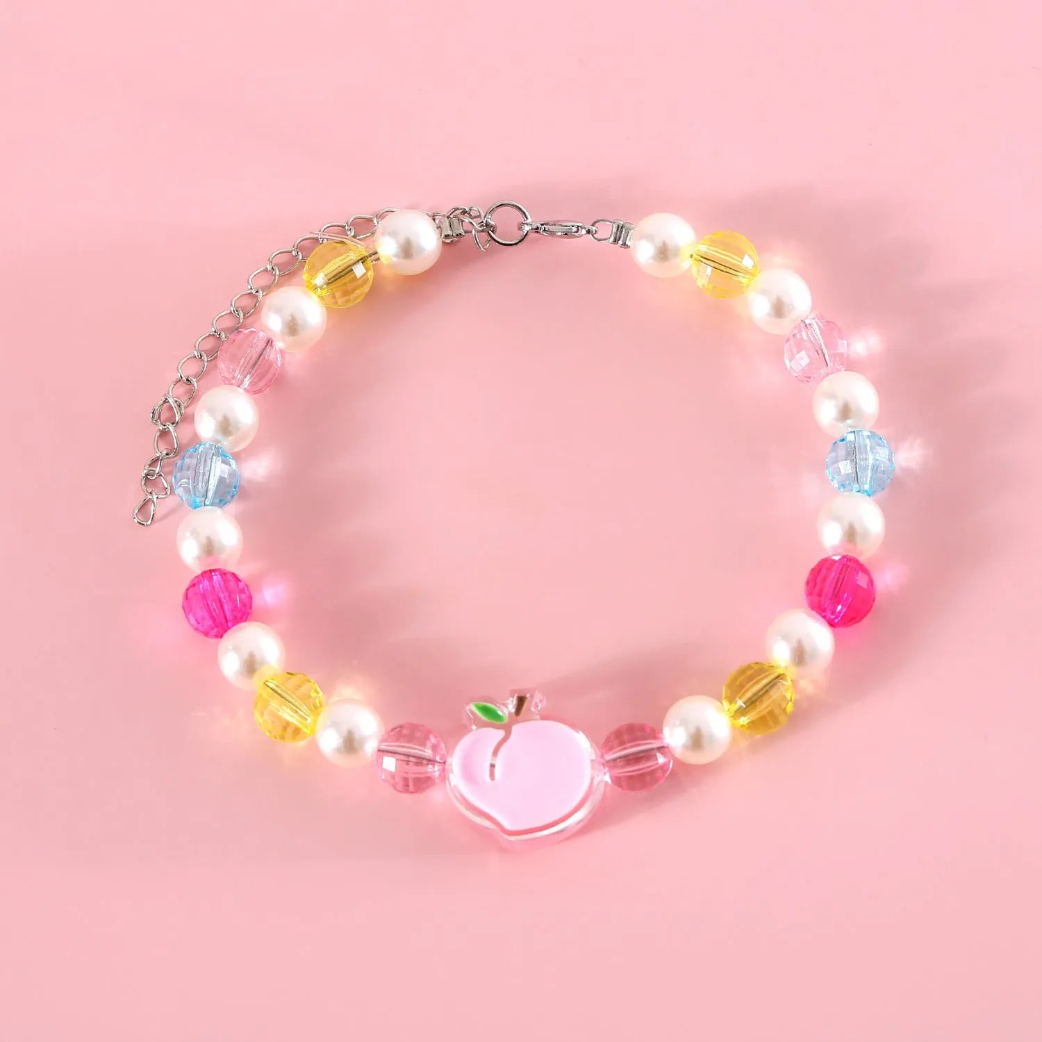 Colourful plastic bead cat necklace with adjustable sizing in peach, rainbow, and small flower patterns