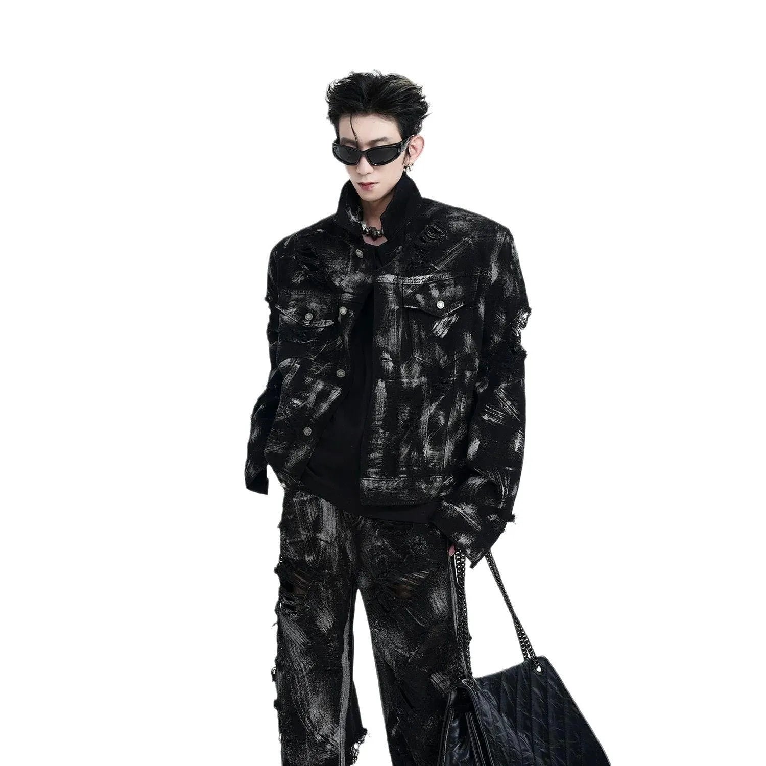 Men's black and grey-pink heavyweight washed denim jacket and jeans set with graffiti style detailing.