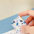 White rubber brick eraser for clean pencil mark removal.