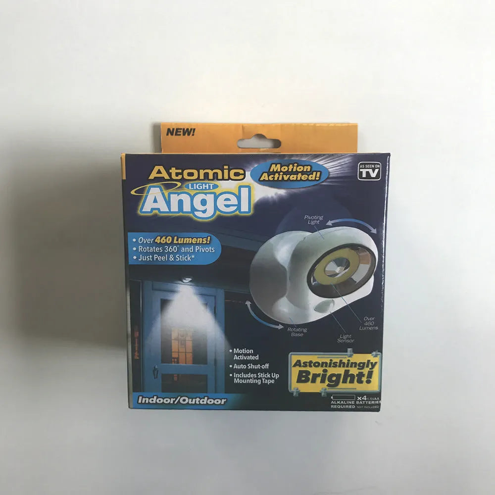 White Atomic Angel induction lamp with dimensions 13.3cm wide by 9.8cm deep by 15.8cm tall