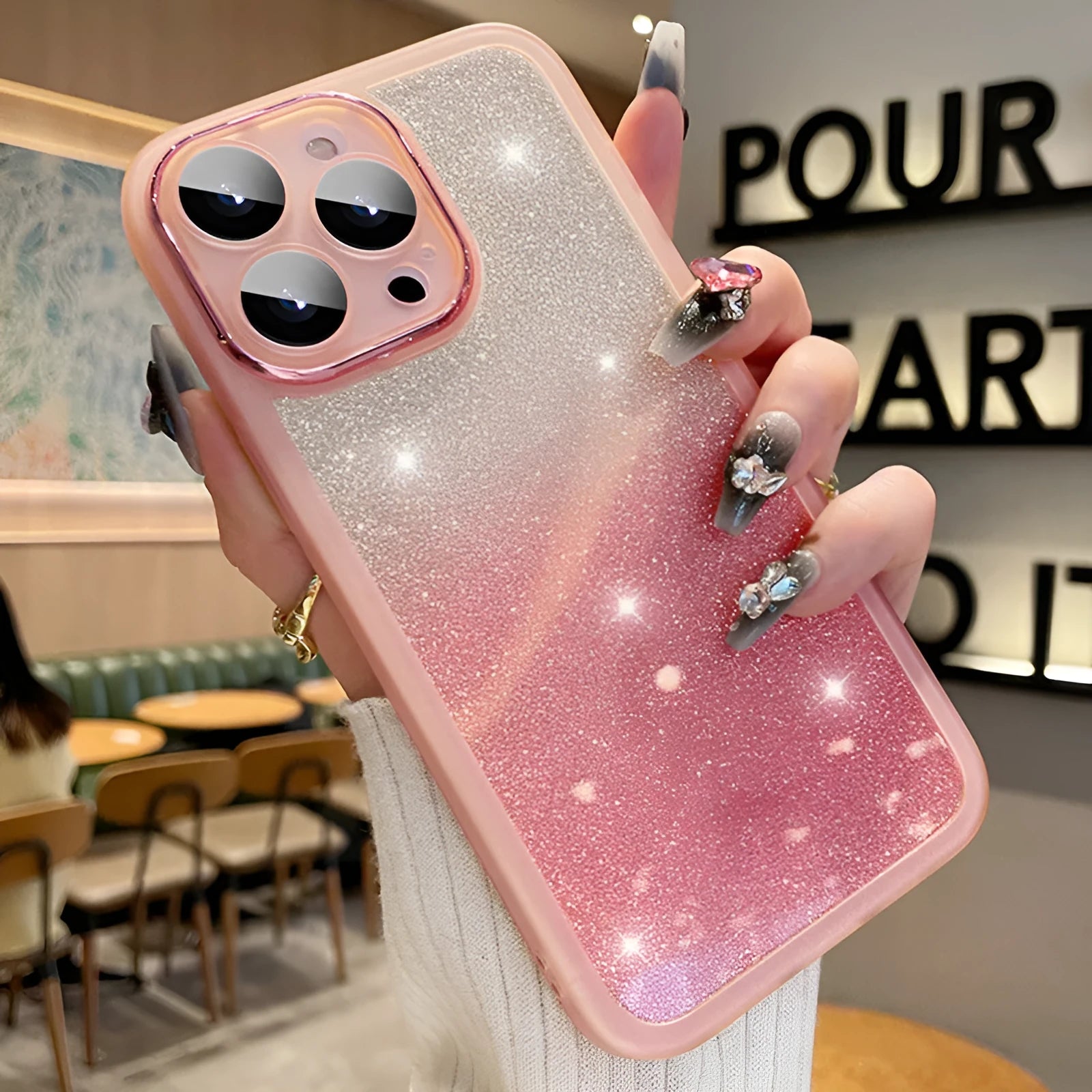 Transparent glitter gradient iPhone case with magnetic suction on a smartphone.