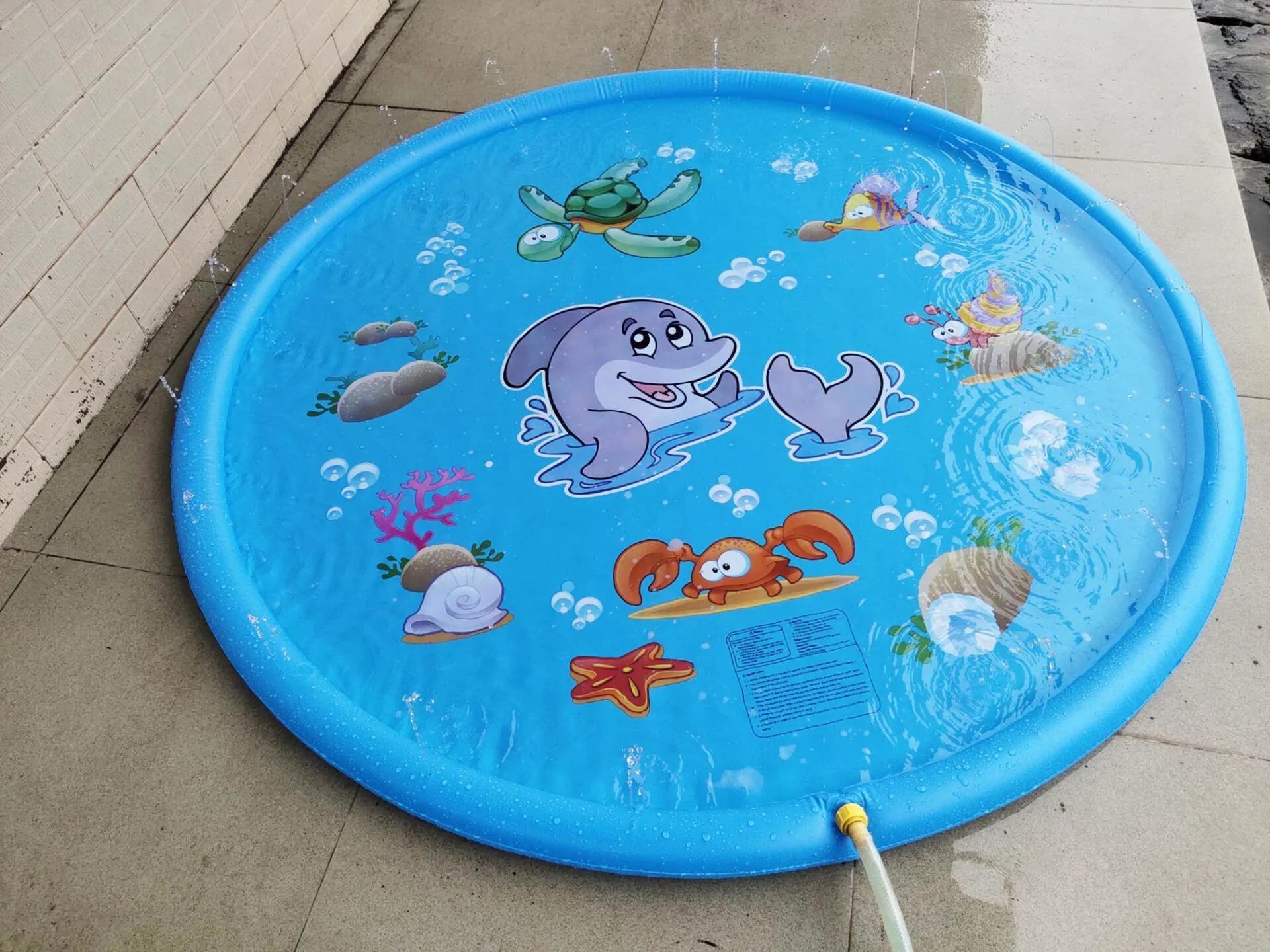 Blue PVC children's water play mat with marine animal designs measuring 100cm or 170cm for garden use