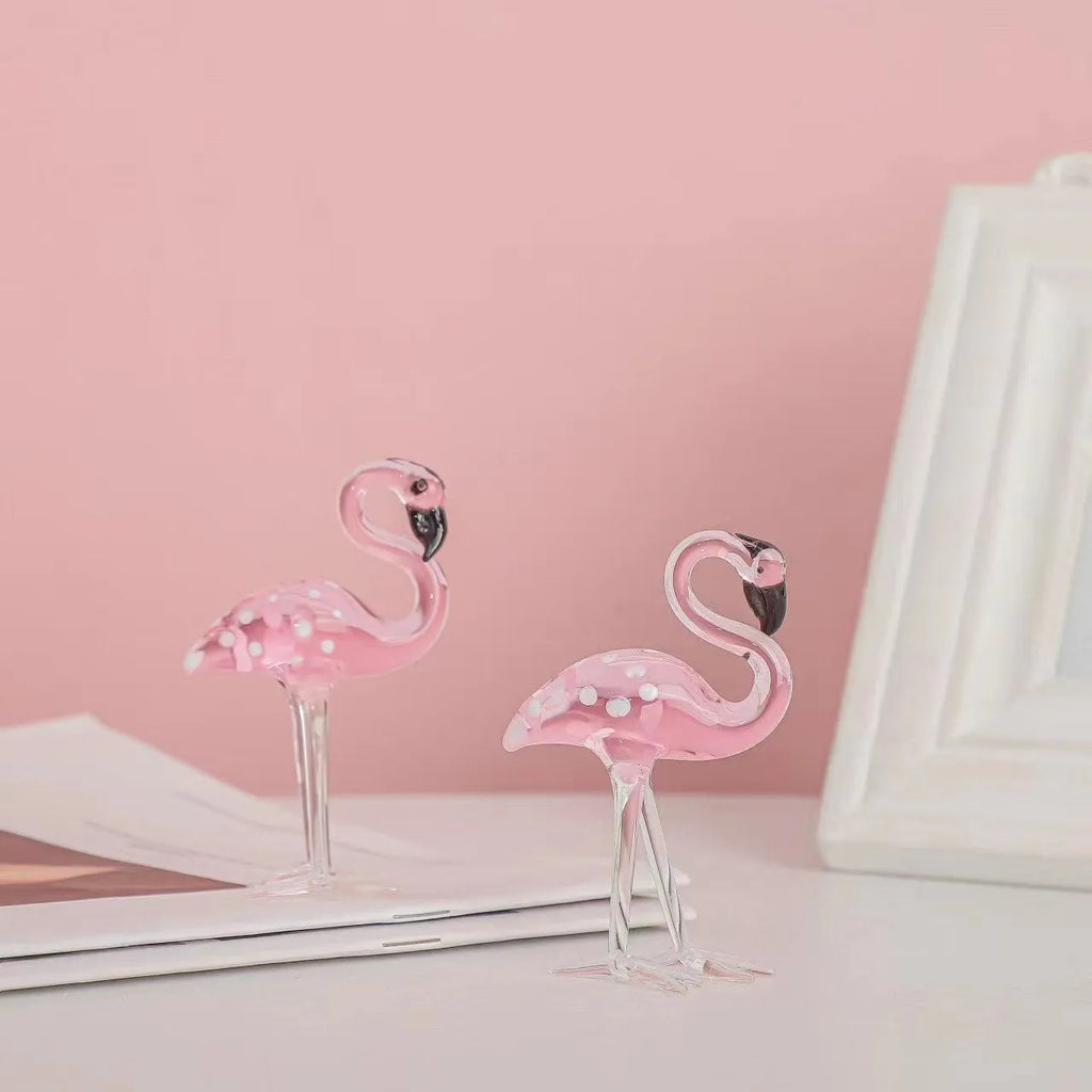 Pink flamingo crystal animal decoration on a tabletop in separate and juxtaposition styles.