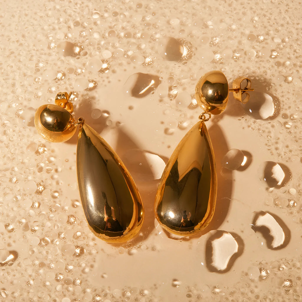 Gold-coloured stainless steel earrings with hemisphere and water drop pendant design