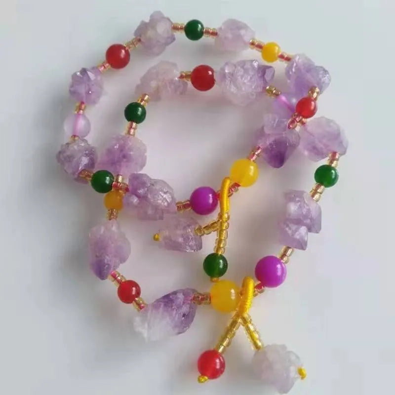 Natural shaped purple amethyst bead bracelet for women with a fu character charm.