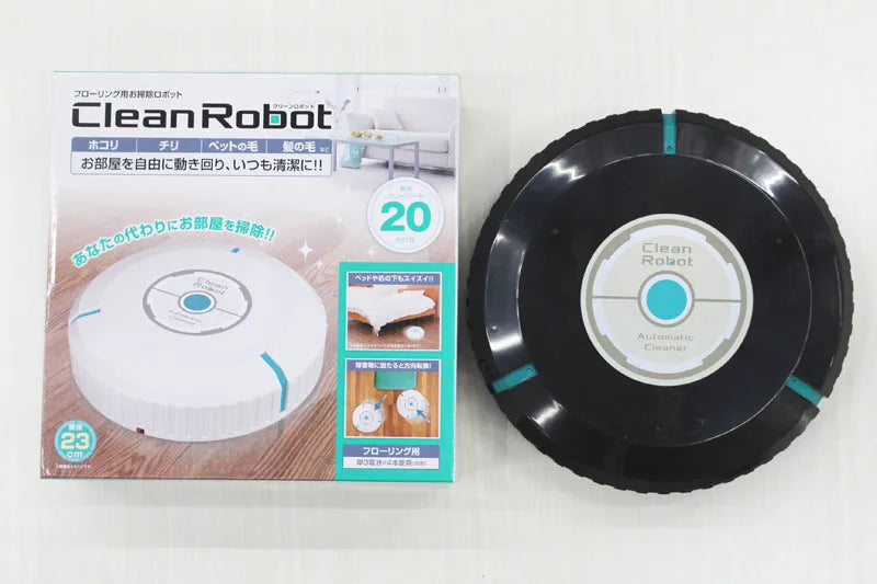 Black or white automatic sweeping robot vacuum cleaner on wooden floor