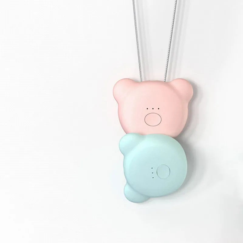 Mini USB air purifier necklace in blue, showing compact rectangular design on a lanyard.