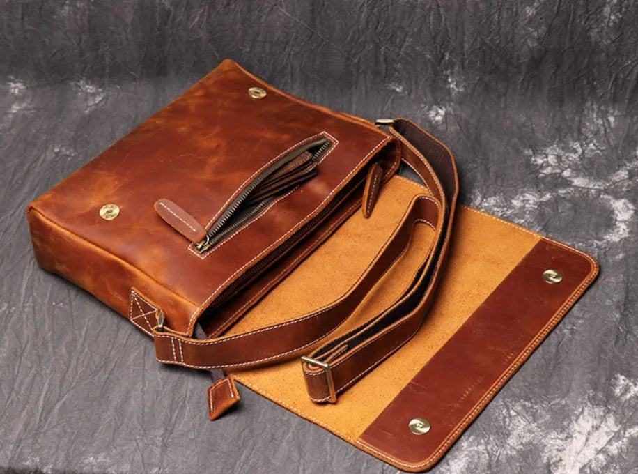 Men's vintage brown leather messenger bag with flap cover and adjustable shoulder strap