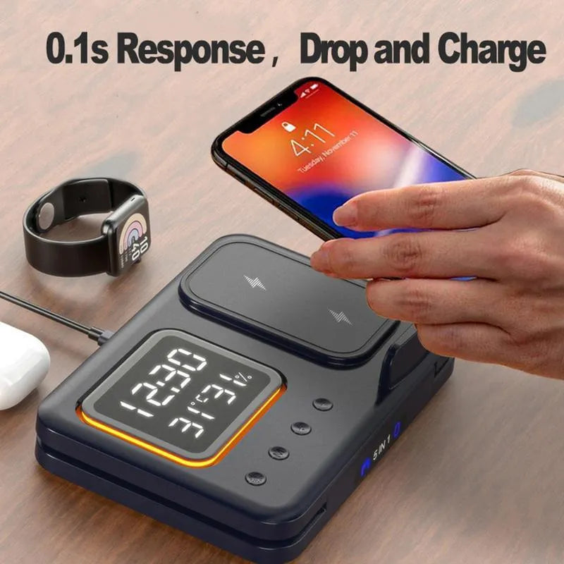 Black wireless charging station with digital clock display showing time and temperature, charging smartphone and smartwatch