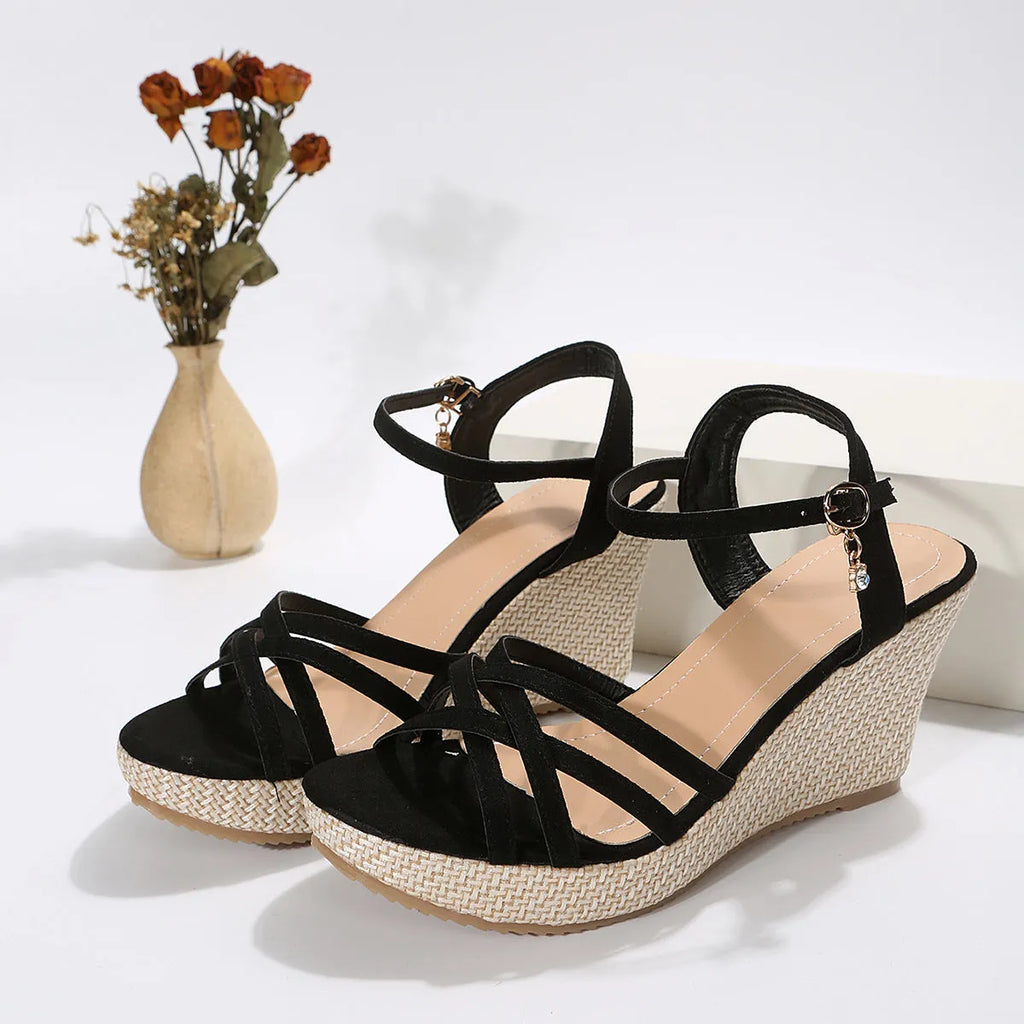 Women's beige wedge sandals with a fish mouth toe opening and cloth upper.