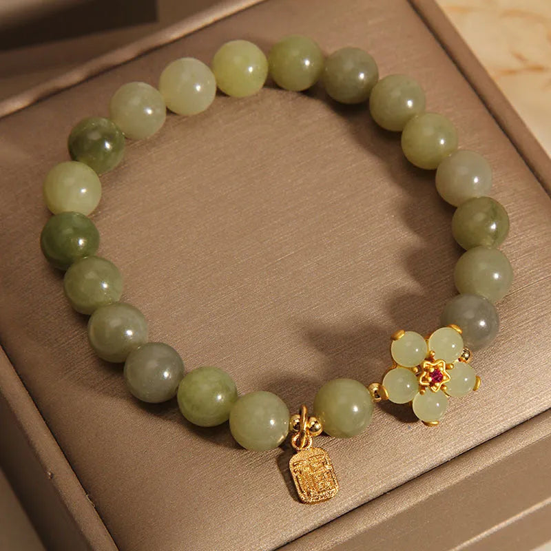 A grey jade coloured alloy bracelet with a casual style for women.