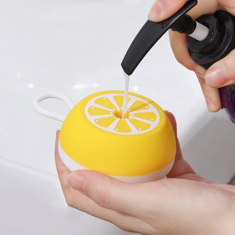 Yellow silicone pet bath brush with massage heads for dog and cat grooming during bath time