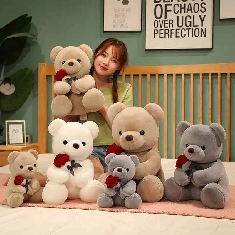 Rose bear plush toy in beige, brown, or grey, shown in sizes from 23cm to 45cm.