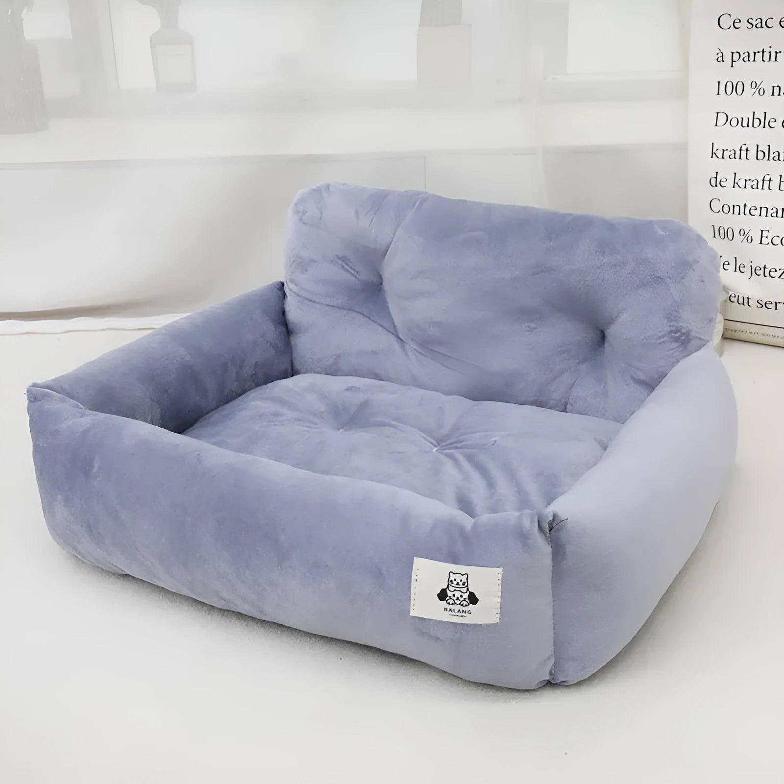 Grey and blue plaid stain-resistant cloth dog car nest in small and large sizes.