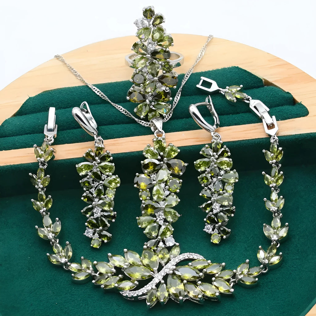 Complete retro jewellery set with floral pattern showing necklace, bracelet, earrings, and ring in olive, purple, or colourful finishes