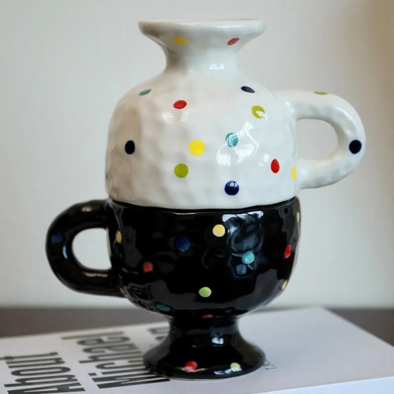 Hand-pinched irregular ceramic mug in a solid colour, shown from the side to display its unique shape.