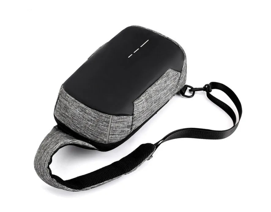 Small dark blue Oxford cloth chest bag with a zipper, shown with dimensions 18cm wide by 31cm high.