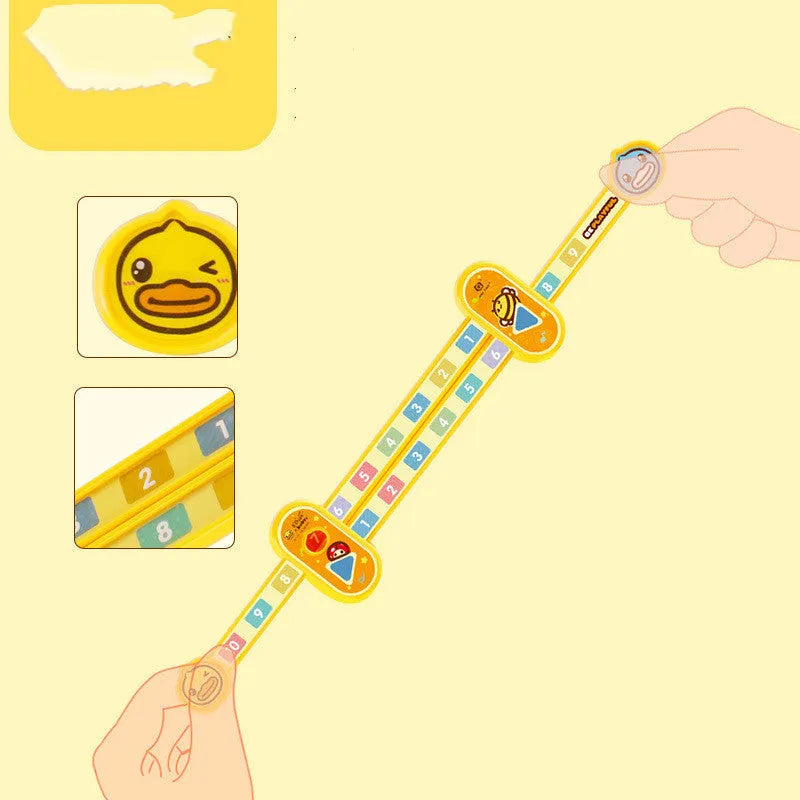 A yellow plastic children's cartoon digital decomposition ruler showing measurements up to 24.5 cm.