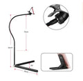 Black mobile phone bed bracket with adjustable universal holder mounted on bed frame