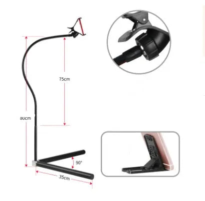 Black mobile phone bed bracket with adjustable universal holder mounted on bed frame