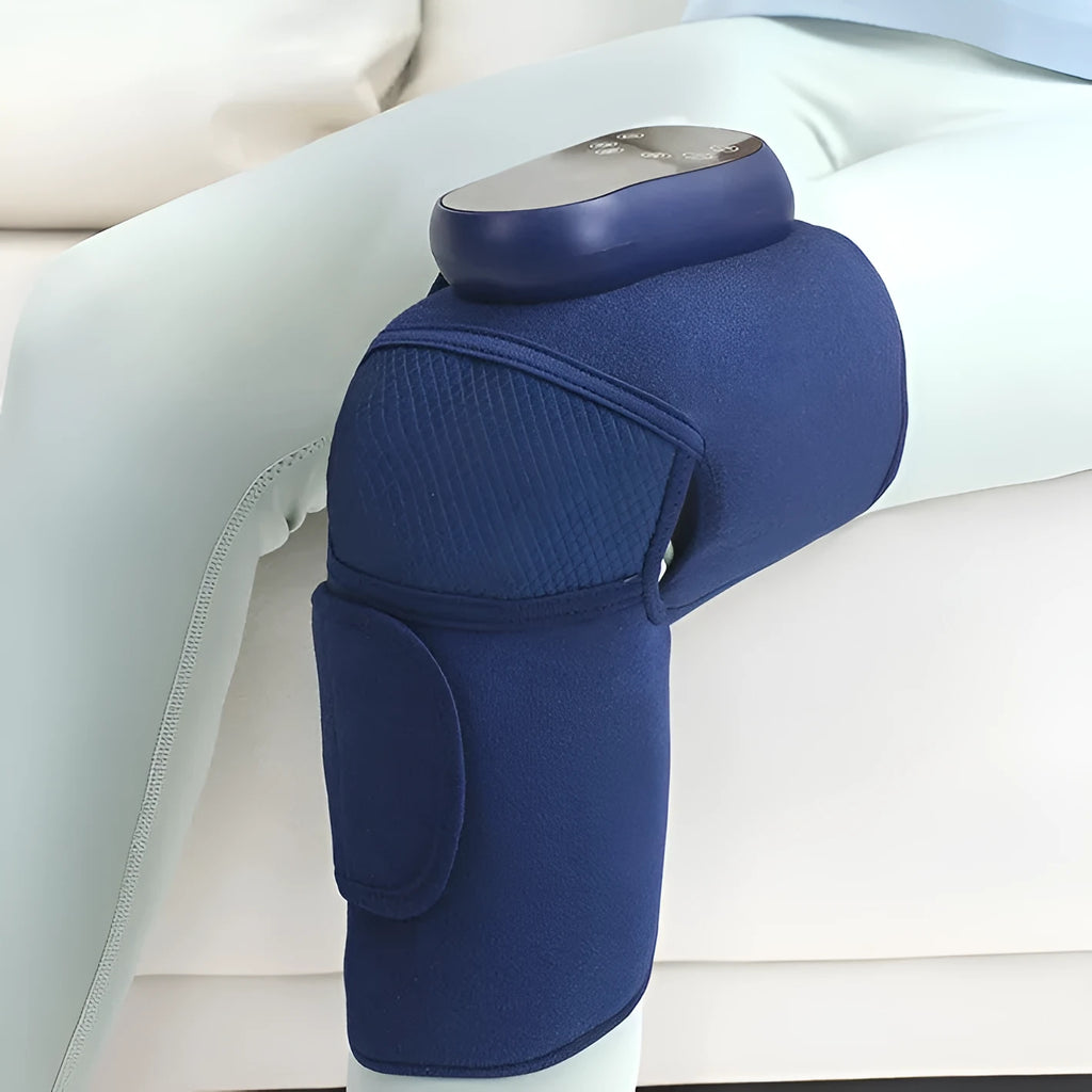 Blue self-heating knee massager showing airbag compression design around knee joint