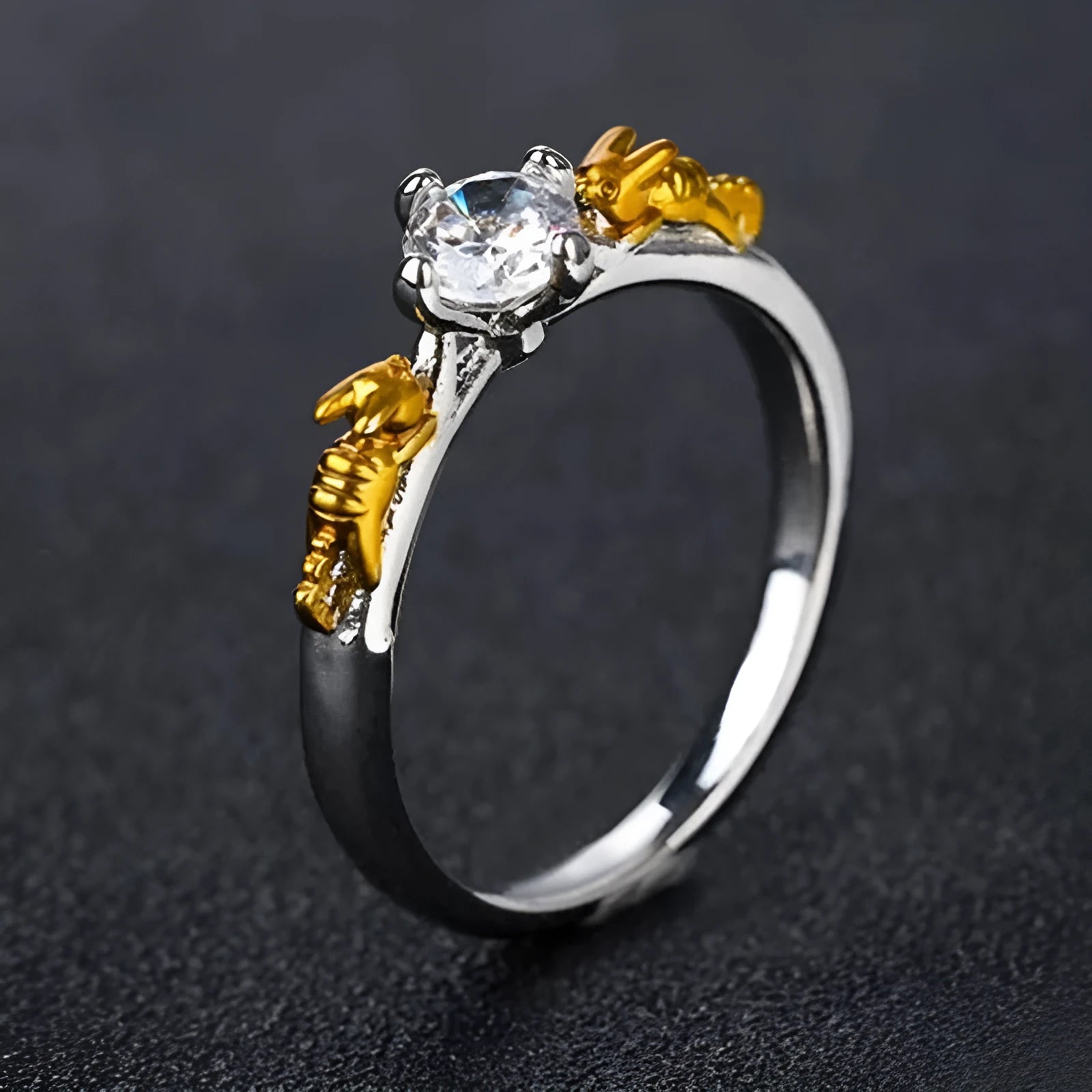 Copper crown crystal ring in black gold colour on a neutral background.